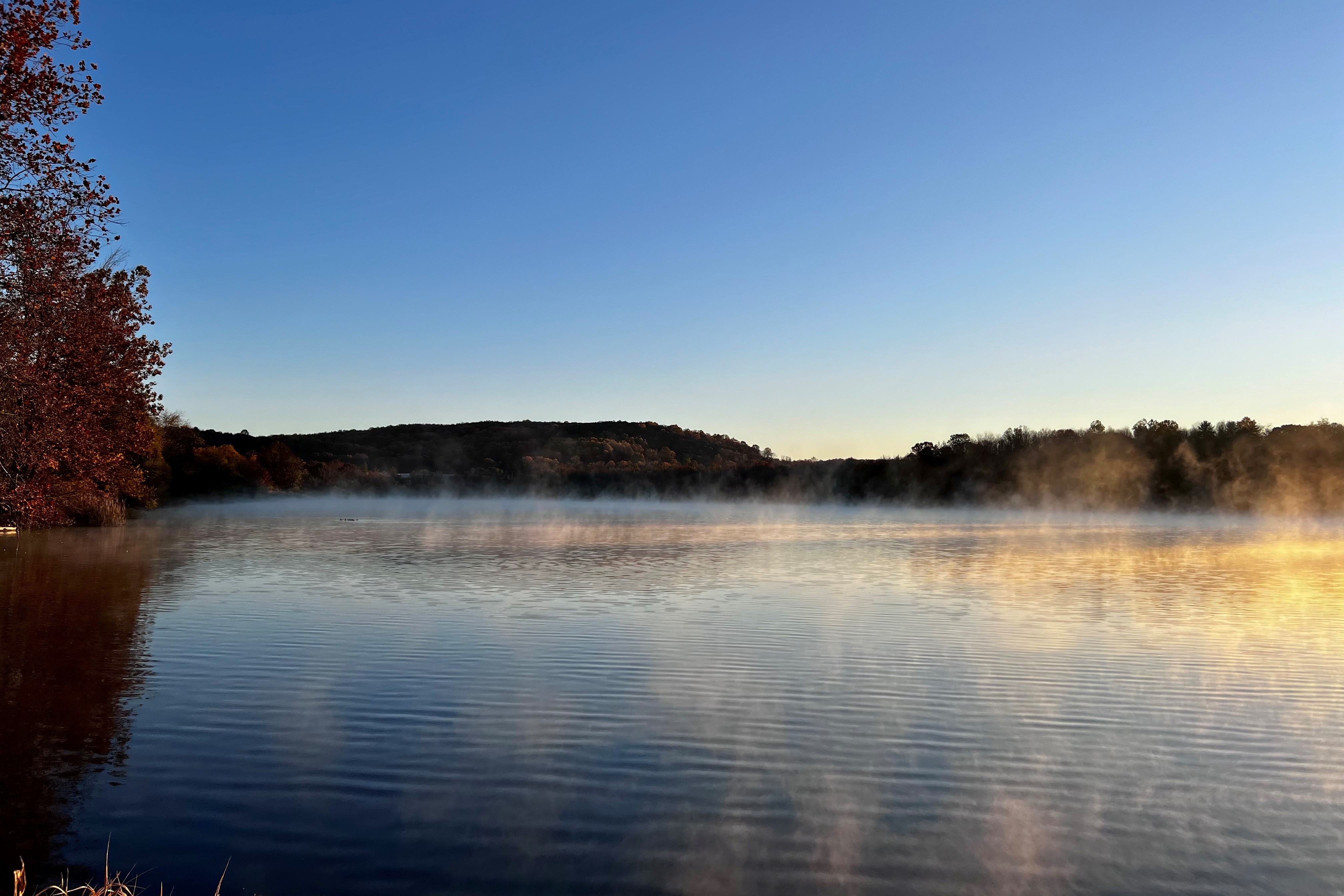 spruce run with steam coming off the surface of the water